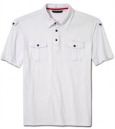 With sleek military styling, this Sean John polo shirt sets your casual wardrobe instantly at attention.