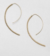 Delicate faceted beads line up along the arc of an artfully shaped hoop with a modern appeal.14k yellow goldLength, about 2Hoop wireMade in USA