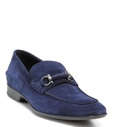 No one steps on these Salvatore Ferragamo loafers: your go-to blue suede shoes rock silver-tone accents for effortless posh.