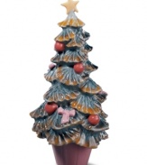 An interesting variation on the classic Christmas tree, Lladro's mini Christmas tree figurine is painted with Lladro's signature palette of soft pastels finished with a high-gloss glaze that catches the eyes. Handcrafted in Spain of pure porcelain.