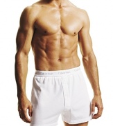 Classic universal fitting knit boxer shorts with buttonfly opening. Clean design for ease of movement. Logo waistband.