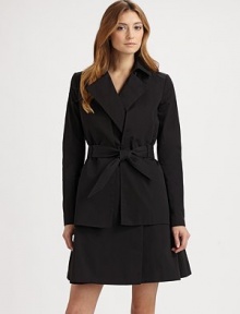 A refined, feminine take on the classic trench, tailored with a slightly fuller skirt and a structured, cropped overlay.Foldover collarNotched lapelsOpen, cropped overlaySelf tie beltFully linedAbout 37 from shoulder to hem82% cotton/18% silkDry cleanMade in France of imported fabricModel shown is 5'11 (180cm) wearing US size 4. 