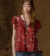 Flirty ruffles and feminine florals create a whisper of vintage romance on Denim & Supply Ralph Lauren's short-sleeved top, crafted in a purposely crinkled construction for an of-the-moment spin.