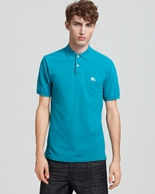 A classic polo from Burberry in a vibrant malachite hue.