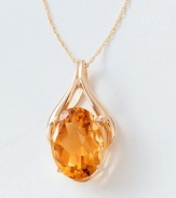 The golden beauty of an oval-cut citrine (8 ct. t.w.) is captured in this graceful 14k gold wishbone pendant. Chain measures 18 inches; drop measures 1-1/4 inch.