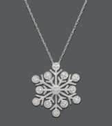 Warm your soul on a cold winter's day. This unique snowflake pendant features a six-prong design with glittering round-cut diamond accents. Necklace crafted in 14k white gold. Approximate length: 18 inches. Approximate drop: 3/4 inch.