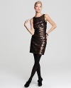 Define modern glamour in this Cynthia Steffe dress, shimmering with triangular bronze sequins under ruched black mesh. Black tights and heels polish off the look for a soirée-perfect finish.