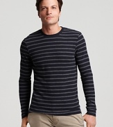 Narrow tonal stripes and sleek silhouette make this crewneck sweater a stand-out from Vince.