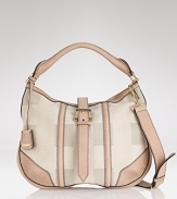 Burberry's leather-trimmed hobo is office perfect. A muted palette ensures it complements all your workday favorites.