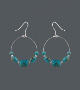 Snap up style that's fresh for summer. These bohemian-inspired wire hoop earrings by Avalonia Road feature turquoise nuggets and a sterling silver setting. Approximate drop: 2 inches.