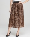 Pull on this VINCE CAMUTO leopard maxi skirt when your look could use an instant shot of cool. A shorter lining peeks out for a chic high/low shadow effect.