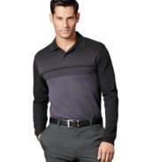 Stripes take this polo from basic to bold in this shirt from Van Heusen.