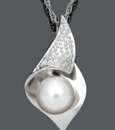 Smooth, delicate, and elegant. This timeless style combines a shimmery cultured freshwater pearl (7-8 mm), sparkling diamond accents and a sterling silver setting. Approximate length: 18 inches. Approximate drop: 9/10 inch.