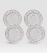 A gift-boxed set of delightful ceramic plates are handcrafted with intricate wreath detail, ideal for holiday giving or entertaining. Set of 4 Arrives in a gift box Each, 6½ diam. Dishwasher safe Imported 