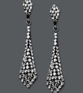 It's a black tie affair. Kaleidoscope's elegant tie-shaped drop earrings shine feature round-cut smokey crystals. Set in sterling silver with Swarovski elements. Approximate drop: 1-1/2 inches.