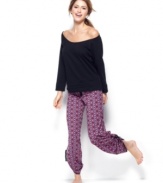 Comfortable cuteness is all yours. Material Girl's sweatshirt has a large round neck and lace inserts at the sides while the baggy lounge pants feature an all-over Aztec patten.