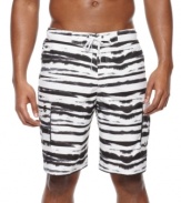 Wet and wild! Show off your vibrant personality with these attention-getting swim trunks from Izod.