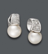 Say hello to elegance. Belle de Mer stud earrings feature a luxurious mix of cultured freshwater pearls (9-10 mm) and sparkling, round-cut diamonds (1/5 ct. t.w.) in a 14k white gold wave setting. Approximate drop: 3/8 inch.