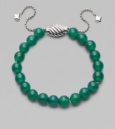 Rich green onyx is fastened by an adjustable clasp of sterling silver.Green onyx Sterling silver Bead diameter, about ¾ Imported