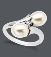 Wrap yourself in ultimate elegance. A clever wrap ring features two smooth cultured freshwater pearls (7-9 mm) at the ends. Crafted in sterling silver. Size 7.