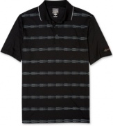 Golf clothes made right. You'll be on par for great comfort and style with this striped performance polo golf shirt from Greg Norman for Tasso Elba, featuring PlayDry technology.