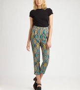 Sophisticated pleats, high rise and a vivacious tribal print define these cropped, crepe de chine pants. Side zipperSlash pocketsRise, about 12Inseam, about 25Fully linedPolyesterDry cleanMade in USA of imported fabricModel shown is 5'10 (177cm) wearing US size 2.