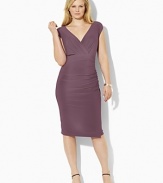 Delicate ruching accents this feminine stretch jersey dress, beautifully crafted with a flattering crossover neckline and empire waist for timeless elegance.