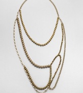 An artistic and modern design with faceted and smooth beads and various link chains in an abstract style. Glass and acrylic beadsGoldtone brassLength, about 47Slip-on styleImported 