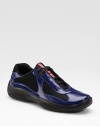 Shiny patent leather and mesh with logo tongue detail. Leather lining Padded insole Rubber sole Imported 