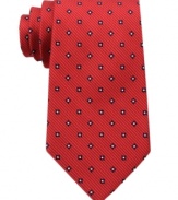 A bold pattern make this Tommy Hilfiger silk tie pop for a look that's sure to get you noticed.