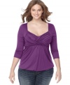 Soprano adds a fresh twist to the three-quarter sleeve plus size top, featuring a crisscross front.