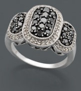 Simple scintillation with a glamorous vintage vibe. Sterling silver ring features unique oval patterns crafted in round-cut black diamonds (1/2 ct. t.w.) and white diamonds (1/5 ct. t.w.). Size 7.