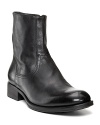 Leather short boots with side zip and rounded toe. Leather stacked heel on treaded, rubber sole.