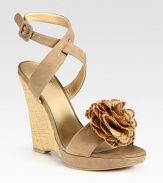 Adjustable, soft leather straps and an artful flower adornment add ladylike vibes to this timeless straw wedge. Straw wedge, 4 (100mm)Covered platform, ½ (15mm)Compares to a 3½ heel (90mm)Suede and straw upperLeather lining and solePadded insoleMade in SpainOUR FIT MODEL RECOMMENDS ordering true size. 