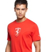 This startling red shirt pairs well with the Ferrari logo, as well as the Puma logo on the left sleeve. With a short crew neck and 100% cotton material, you'll feel the wind on your chest even if you aren't driving.