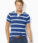 A short-sleeved polo shirt is tailored for a comfortable, classic fit with thin multi-stripes for a sporty appeal.