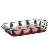 Present your holiday cooking in perfect seasonal style with this baking and serving set. The classic Pyrex baking dish is great for making any meal – from dinner to dessert – while the tree-lined wire and wicker basket acts as a cheery trivet for a spirited tabletop display. One-year warranty.