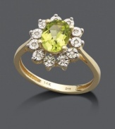 Create an eye-catching effect in this gleaming, green ring. An oval-cut peridot (1-1/3 ct. t.w.) is highlighted by a ring of round-cut diamond accents. Crafted in 14k gold and 14k gold with rhodium plating.