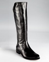 In smooth, polished leather, Corso Como's Rhia boots stand out with buttoned foldover details.