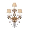 The curved arms, cascading crystals and candle flame-shaped bulbs on this Ralph Lauren sconce will illuminate your decor with unparalleled glamour.