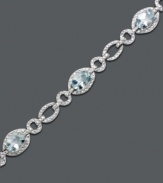 Inspired by crystal clear ocean waves. Luminous oval-cut aquamarine (5 ct. t.w.) shines as brightly as the diamond-accented oval links of this bracelet crafted from sterling silver. Approximate length: 7 inches.