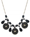 A bold example of modern style, this Style&co. statement necklace features jet-colored glass beads and drop discs with intricate diamond-cut detail. Crafted in gold tone mixed metal. Approximate length: 18 inches + 2-inch extender. Approximate drop: 5 inches.