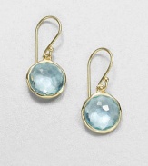 From the Lollipop Collection. Exquisitely faceted blue topaz drops, framed in gleaming 18k yellow gold. Blue topaz 18k yellow gold Drop, about 1 Diameter, about ½ Ear wire Imported