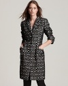 Pop the collar to expose the leather underside of this unique Anne Klein New York coat, rendered in a bold optic print for a mod vibe during the chill.