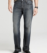 A comfy, everyday relaxed fit jean in a dark wash with distressed edges, light fading and contrast embroidery at pocket.