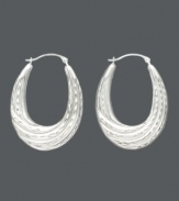 A lady can never go wrong with a classic pair of hoop earrings, especially when they have a twist. Made of 14k white gold, these hoops have an oval shape and feature a graduated twist hoop design. Approximate drop: 1-1/4 inches. Approximate width: 3/4 inch.