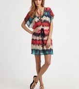 A bohemian-chic style with a flattering, elastic waistband and tie front detail. Deep plunge v-neckShort kimono sleevesElastic waistline with tie detailSide slits74% cotton/26% silkDry cleanMade in USA of Italian fabricsAdditional Information Women's Premier Designer & Contemporary Size Guide 