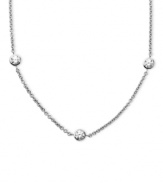 Delicate design with a touch of sparkle. Arabella's pretty necklace is set in sterling silver with seven round-cut Swarovski zirconia stations (3-1/6 ct. t.w.). Approximate length: 18 inches.