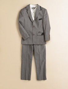 He'll love to play dress up in this essential wool-blend, single-breasted suit jacket with notch lapel.Notch lapelLong sleeves with button detail cuffsSingle-breasted with two button silhouetteTwo front faux-slash pocketsInside patch pocketBack ventFully lined96% wool/4% elastaneDry cleanImported Please note: Number of buttons may vary depending on size ordered 