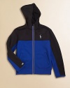 Crafted in stretchy athletic fleece, this ultra-light, full-zip hoodie is designed with bold colorblocked details and reflective accents for a cool, sporty look.Attached hoodLong sleevesFull-zip frontAngled hand pocketsPolyesterMachine washImported